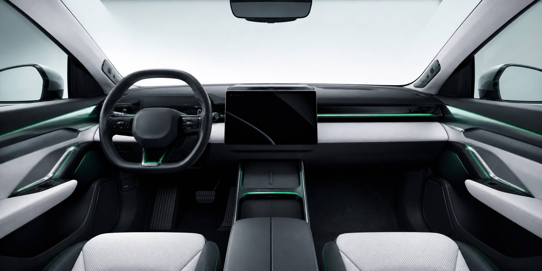 Plancia minimalista con grande schermo e volante